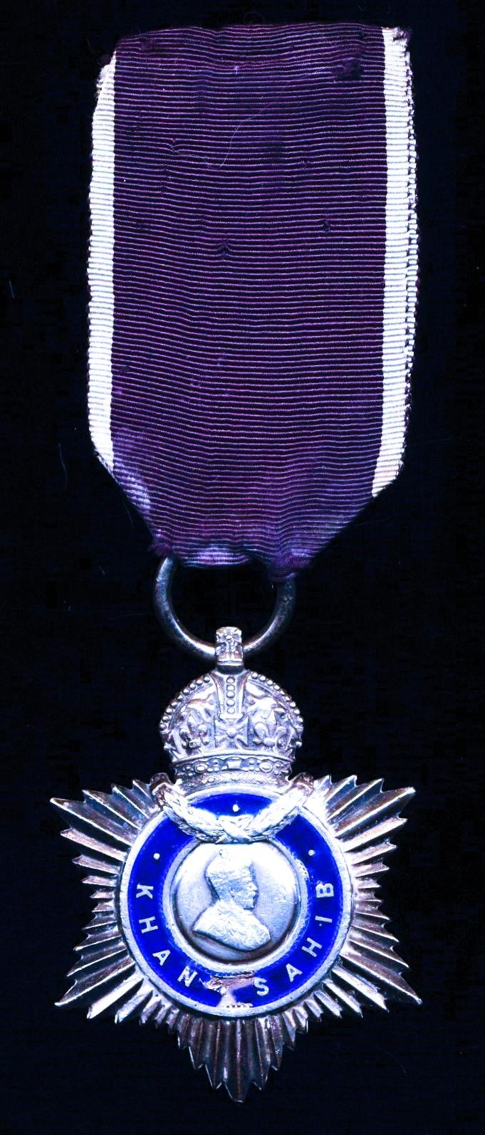 India Title Badge. 3rd Class 'Khan Sahib'. GV issue, 'portrait facing right' in silver and enamel (Khan Mohammad Khan / Zaman Khan / 4th June 1928)