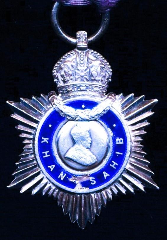 India Title Badge. 3rd Class 'Khan Sahib'. GV issue, 'portrait facing right' in silver and enamel (Khan Mohammad Khan / Zaman Khan / 4th June 1928)