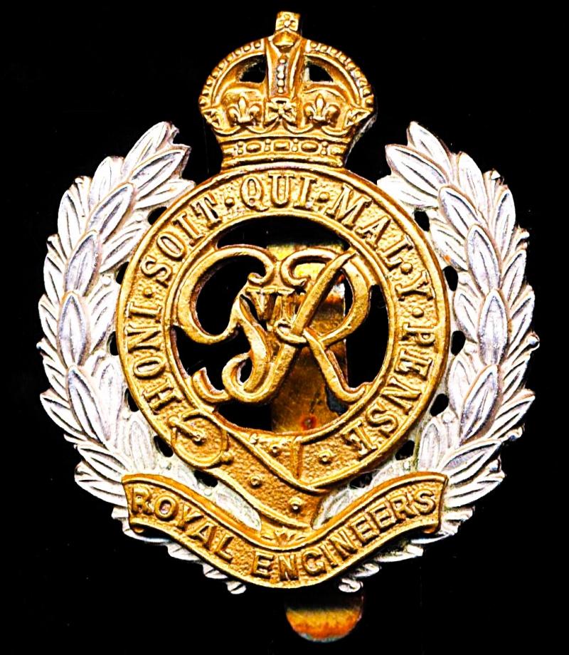 Royal Engineers. GVI King's Crown bi-metal die-struck cap badge with fretted laurels & voided centre. Circa 1947-1952