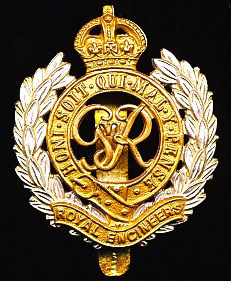 Royal Engineers. GVI King's Crown bi-metal die-struck cap badge with fretted laurels & voided centre. Circa 1947-1952