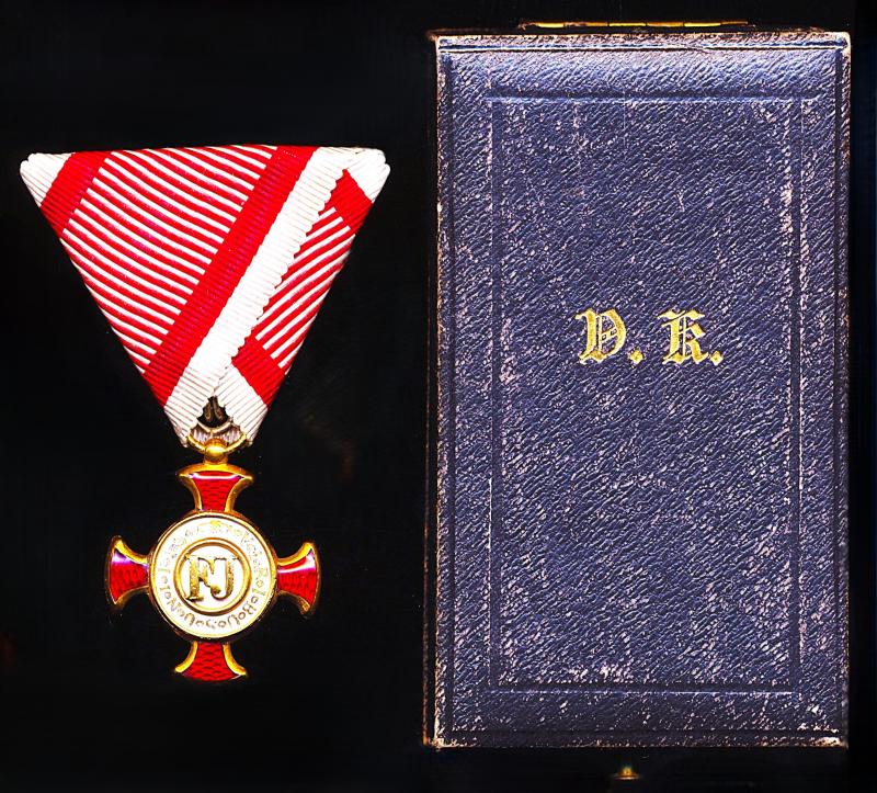 Austria (Imperial): Golden Cross of Merit. On wartime military riband. with 'Emperor Franz Joseph' FJ monogram. Gold (Gilt) & enamel