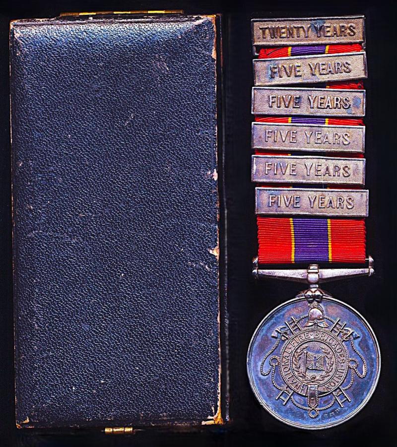 National Fire Brigade's Union Long Service Medal. Silver (H/M) issue with integral 'Twenty Years' top clasp and 5 x 'Five Years' clasps. Named (O. Burnell.) & numbered (408)
