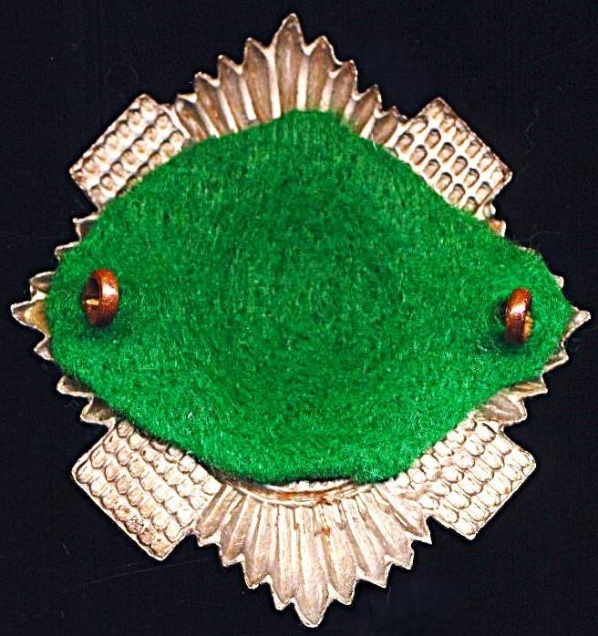 Royal Scots: Cap Badge. 2nd Battalion. Bi-metal with green cloth backing insert, as worn circa 1899-1948