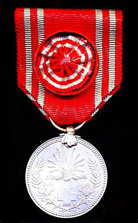 Japan (Showa era): Red Cross Society. Pre 1941 Silvered 'Special Life Members' medal. With silk rosette on riband