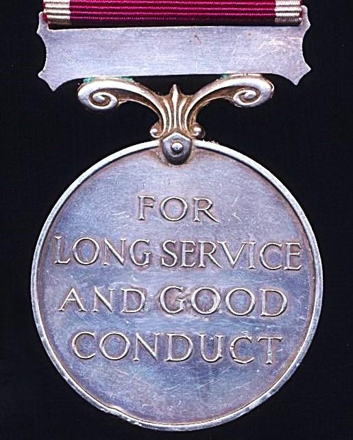Military Long Service & Good Conduct Medal. GV with 'Regular Army' bar (1042100 Cpl. J. Flynn. R.E.)