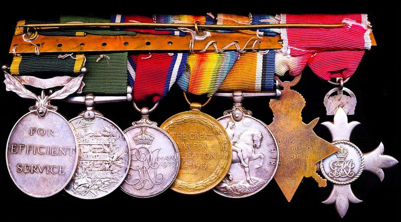 A Volunteer's 'East Africa' casualty medal group of 7: Assistant Controller of Customs, William Robert Clarke, M.B.E., H.M. Indian Customs Service late No. 1 Gun, Bombay Section Volunteer Maxim Gun Company & Bombay Volunteer Rifles
